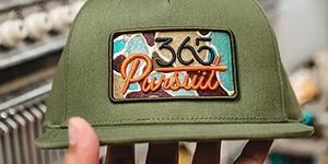 3D puff embroidery design on a hat, showing raised lettering with a dimensional effect.